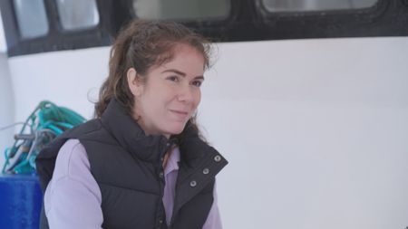 Melissa Marquez, expert, showing the high-speed camera that will be used in the upcoming experiment and how it's technology will allow her to capture the speed of the great white shark that she will be filming whilst in the diving cage. (National Geographic)
