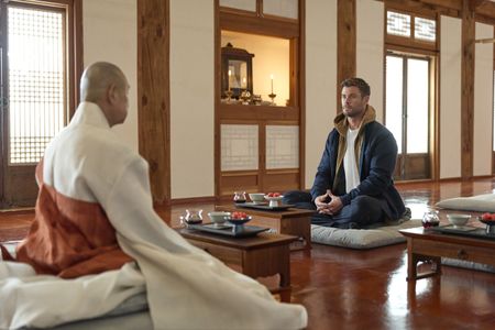 Chris Hemsworth sets out to confront his chronic pain in a bold, immersive journey through South Korea. Chris talks with Jeong Yeo, left, the Grand Patriarch of Beomeosa Temple in Busan, South Korea. (credit: National Geographic/Evan Paterakis)