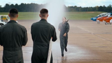 An elated student Capt. Steph Harris celebrates after completing her training. (Credit: National Geographic)