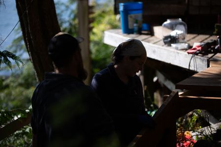 Carl Hernandez and Veronica Arrants construct a ramp on her property. (National Geographic/Mickey Ramos)