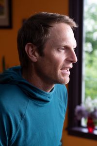 Professional kayaker Ben Stookesberry sits in front of a camera for his interview.  (National Geographic/Harrison Gayton)
