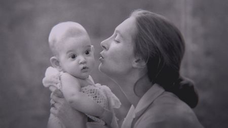 Gombe, Tanzania - Jane Goodall kisses her son Grub. The feature documentary JANE will be released in select theaters October 2017. (Jane Goodall Institute/Hugo van Lawick)