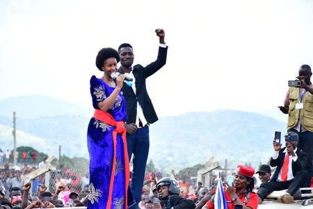 Bobi Wine on top of his vehicle with his wife Barbara ltungo Kyagulanyi as they campaigned in Kasanda district, Central Uganda on November 27, 2020.(photo credit: Lookman Kampala)