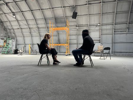 Mariana van Zeller interviews El Gringo in a hangar space in Los Angeles, California. (National Geographic)