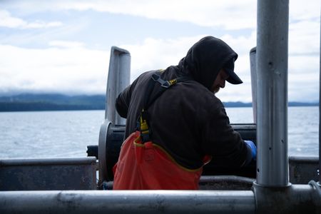 Carl Hernandez fishes for salmon. (National Geographic/Lukas Taylor)