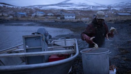 Marvin Agnot preparing crab he caught for his dinner. (National Geographic/Ashton Hurlburt)