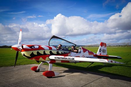 To mimic what its like to turn and move like a hammerhead, extreme athlete Ross Edgley goes up in a stunt plane. (National Geographic/Rhiannon Burton)
