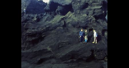People stand on volcanic rocks.  (credit: Archival Materials Courtesy of Andri Snþr Magnason)