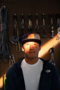 Filmmaker and climber Jimmy Chin with some climbing gear behind him in Los Angeles, CA.  (photo credit: National Geographic/Teague Wasserman)