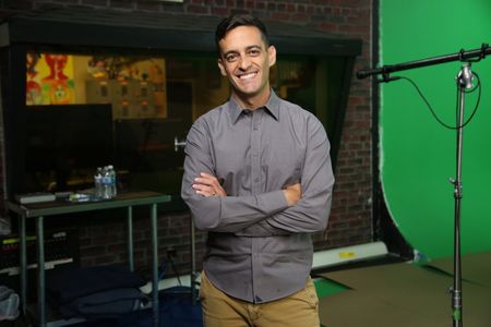 Andrew Nosal standing and smiling with arms crossed. (National Geographic/Robert Toth)