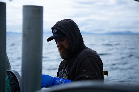 Carl Hernandez fishes for salmon. (National Geographic/Lukas Taylor)