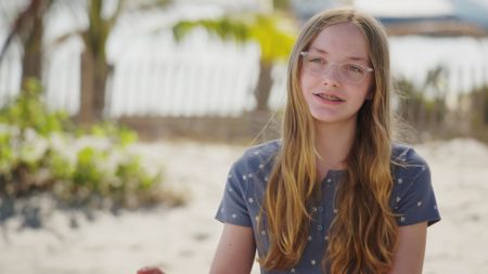 Magnolia Woodhead, contributor, reflecting on the day that she was bitten by a shark whilst being on a family vacation and playing in the water. (National Geographic)