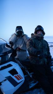 Chip and Agnes Hailstone glass the tundra while hunting for caribou.(BBC Studios Reality Productions, LLC/Ashton Hurlburt)
