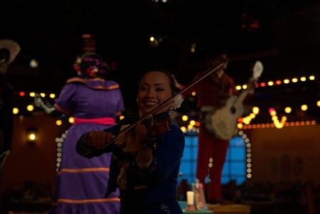 Violinist Erendira is part of the mariachi trio in Plaza de Coco on the Disney Treasure.  (credit: National Geographic/Matt Perez)