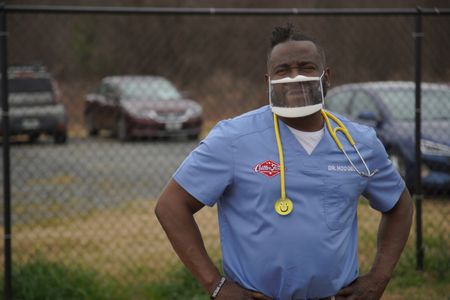 Dr. Hodges takes a well-deserved break outside the clinic. (National Geographic for Disney/Sean Grevencamp)