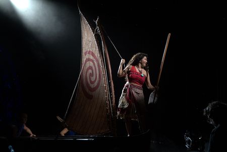 Moana sails on her canoe during a dress rehearsal of "Disney The Tale of Moana," the new stage production on the Disney Treasure.  (credit: National Geographic/Matt Perez)