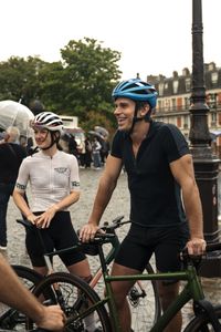 Antoni Porowski chats with members of the Montmartre Velo Club after cycling through the streets of Paris. (National Geographic/Puxan Photo)