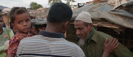 Kamal Hussein thanks an older man for looking after Dokana, a lost child. Lost and Found, directed by Academy Award winner Orlando von Einsiedel (“The White Helmets”, “Virunga"), is an inspiring story of humanity and heroism in the world’s largest refugee camp, that follows Kamal Hussein, a Rohingya refugee who has dedicated his life to reuniting children with their parents. (Nobel Media)
