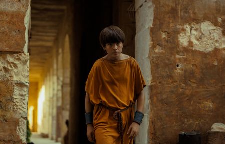 Avianius, played by Frankie Treadaway, strides home through Pompeii after his argument with Marcus Masurius. (National Geographic/Darrin Zammit Lupi)