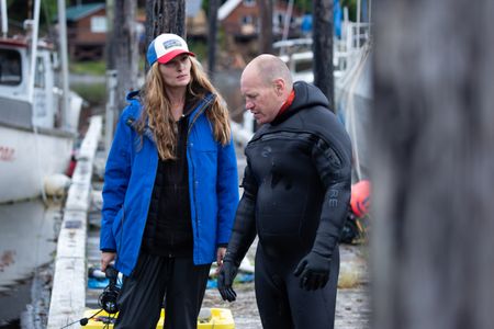 Sarah McDonald assists Troy Brockway as he scuba dives, searching for potential helpful sunken treasures. (National Geographic/Kelly Robertson)