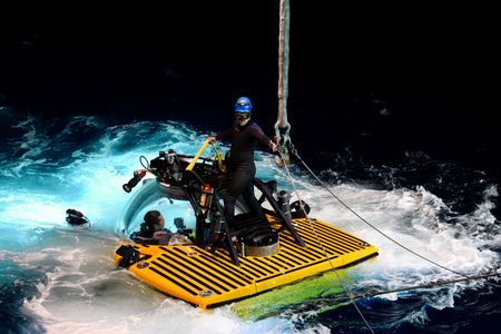 George Scott unhooks the submarine with Jorge Fontes inside. (National Geographic/Mario Tadinac)