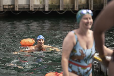Antoni Porowski emerges from the water after swimming at Canary Wharf. (National Geographic/John Wendle)