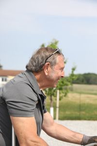Art Reinhold works on the Pol family farm's garden. (National Geographic)