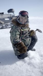 Asher Ulroan ice fishing with his grandparents. (National Geographic/Matt Kynoch)