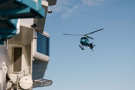 The helicopter approaches OceanXplorer for landing. (National Geographic/Mario Tadinac)