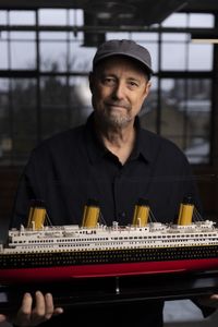 Parks Stephenson stands with a model of RMS Titanic. (National Geographic/Freddie Claire)