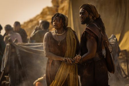Marcus Masurius, played by Theo Ogundipe, and Aurelia Masuri, played by Angelina Chudi, suddenly spot Avianius across the Pompeii displacement camp. (National Geographic/Darrin Zammit Lupi)
