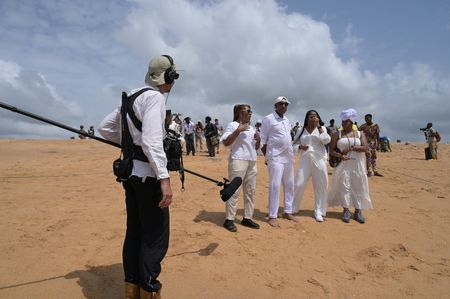 Crew member Rodrigo Salvatierra captures the Clotilda descendants on Ouidah Beach discussing the traumatic events that unfolded during the Transatlantic Slave Trade. (National Geographic/Etinosa Yvonne)