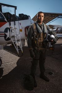 Portrait of student Captain Micah Nissly next to a T-45. (Credit: National Geographic/Freddie Claire)