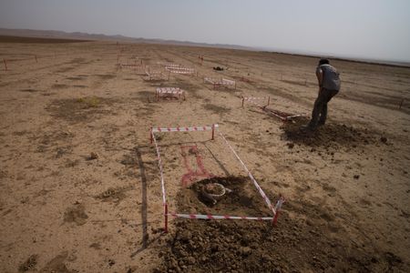 Sinjar, Iraq - An unexploded mine is sectioned off in a minefield. (Sean Sutton)