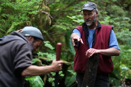 Dave Palmer and Jiggy Nichols rebuild a dam in their community. (National Geographic/Wayne Moss)