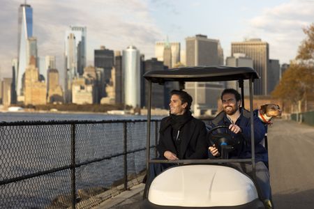 Antoni Porowski and his dog Neon get a tour of Governor's Island from one of its caretakers, Tristan. (National Geographic/Jose Alvarado Jr.)