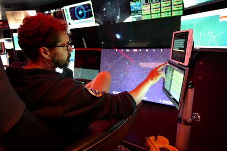 Ewan Basin sits in ROV Mission Control. (National Geographic/Mario Tadinac)