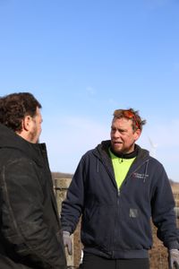 Charles Pol and Ben Reinhold discuss their ideas for catching the Merino sheep for shearing. (National Geographic)