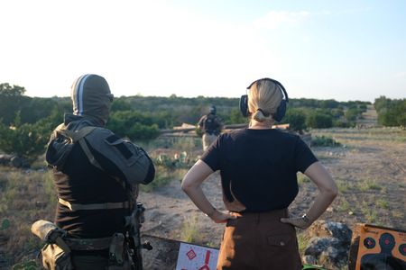 Mariana van Zeller attends shooting practice with members of the Black Cat Rifle Group. (National Geographic)