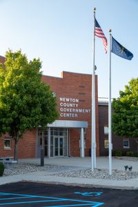 Flags flutter outside Newton County Government Center, workplace of Coroner Scott McCord. (National Geographic/Tom Beard)