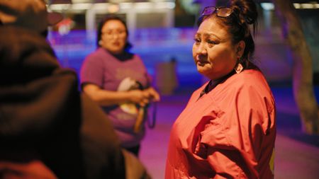 Reva Stewart asks people on the street if they have seen Tim and Deb's son, Christopher, in Phoenix, Arizona. (National Geographic)