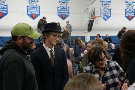Dr. Ben Schroeder and son Chase Schroeder chat with Ben's mother Sally Ann Schroeder and other family members who came to see Chase's school musical. (National Geographic)