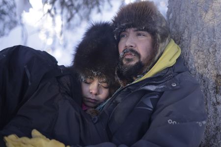 Tig and Hazel Strassburg rest while they check their trapline in the winter season. (National Geographic/Wayne Shockey)