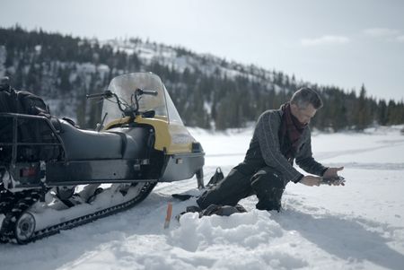 Joel Jacko fishing on the frozen lake. (National Geographic/Wayne Shockey)