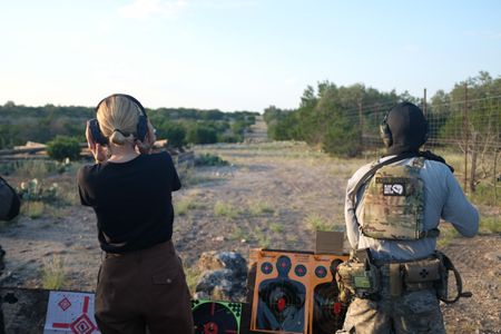 Mariana van Zeller attends shooting practice with members of the Black Cat Rifle Group. (National Geographic)