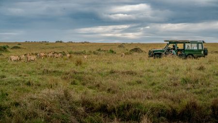 Members of Summer's Pride move past the film vehicle as the crew documents their day. (National Geographic/Matthew Tomlinson)