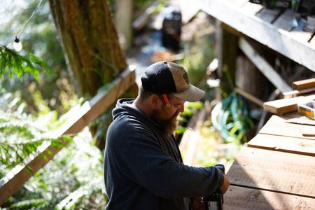 Carl Hernandez helps construct a ramp on his neighbor's property. (National Geographic/Mickey Ramos)