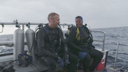 Dr. Mike Heithaus, expert, and Candace Fields, expert, sat onboard the charter boat in Florida after a successful shark experiment dive. (National Geographic)
