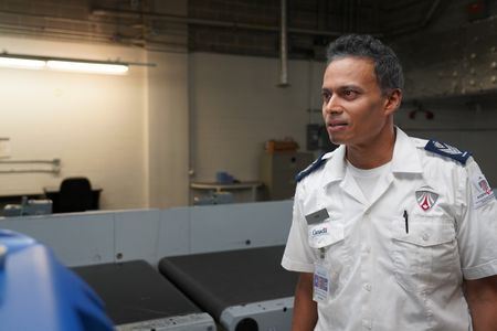 Ash Gobin, Screening Officer, CATSA, in the Baggage area. (Arrow International Media Ltd & Cantina Media)