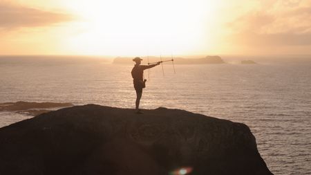Shark expert Lauren Meyer listens for a signal coming back from supersized Tiger Sharks tagged off the remote shores of Norfolk Island in Australia. (National Geographic)